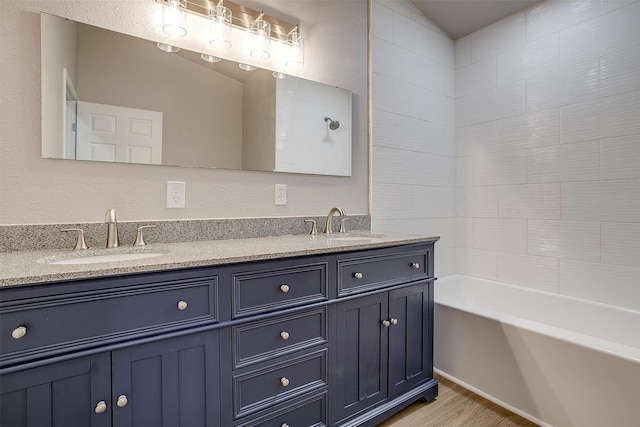 716 SE 7th Ave, Mineral Wells, TX 76067 - bathroom with wood finished floors and double vanity