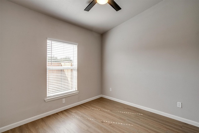 unfurnished room featuring light wood-type flooring and ceiling fan