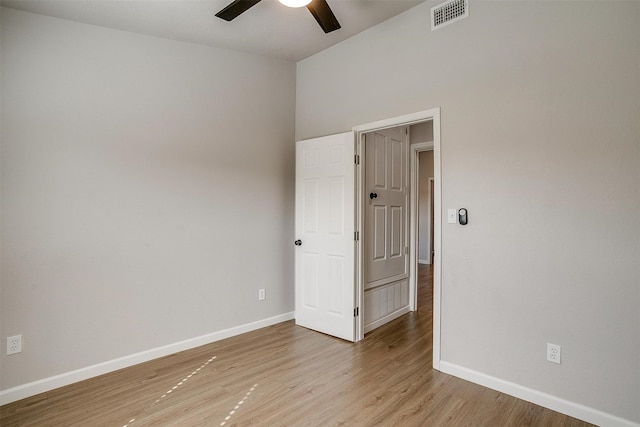 spare room featuring light hardwood / wood-style floors and ceiling fan