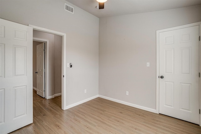 spare room featuring ceiling fan and light hardwood / wood-style flooring