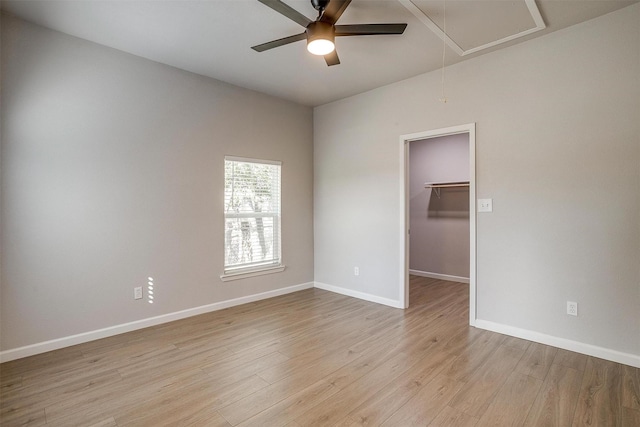 716 SE 7th Ave, Mineral Wells, TX 76067 - unfurnished room featuring attic access, a ceiling fan, light wood-type flooring, and baseboards