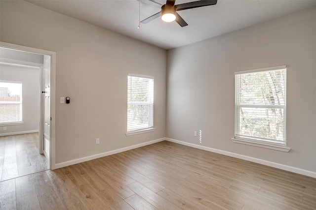 empty room with light wood-type flooring and ceiling fan