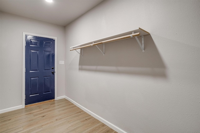 walk in closet featuring light wood-type flooring