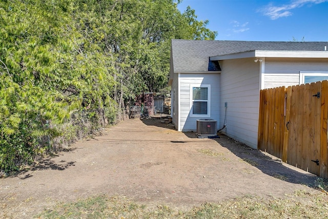 716 SE 7th Ave, Mineral Wells, TX 76067 - view of home's exterior with fence and roof with shingles