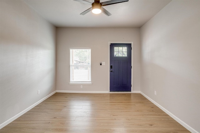 entryway with light hardwood / wood-style floors and ceiling fan