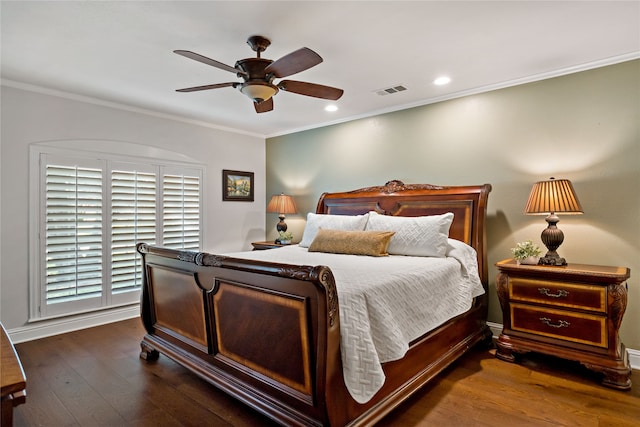 bedroom with ceiling fan, crown molding, and dark hardwood / wood-style floors