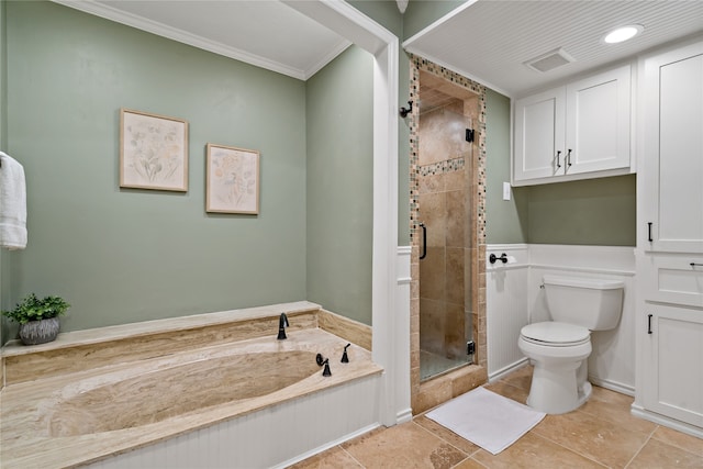 bathroom with toilet, tile patterned floors, and separate shower and tub