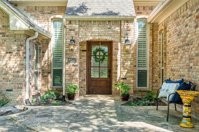 doorway to property with a patio area