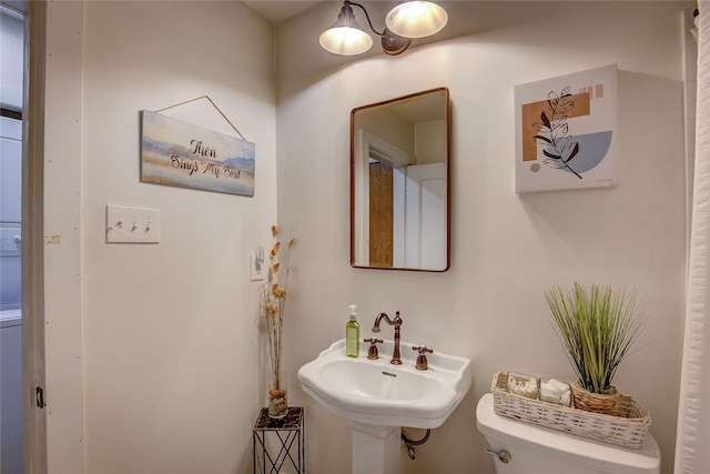 bathroom with toilet and sink