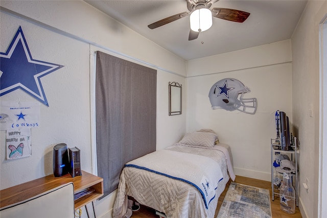 bedroom featuring ceiling fan and wood-type flooring