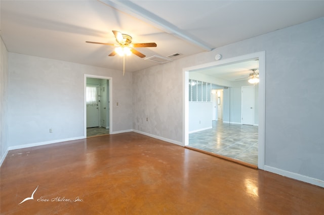 empty room with concrete floors and ceiling fan