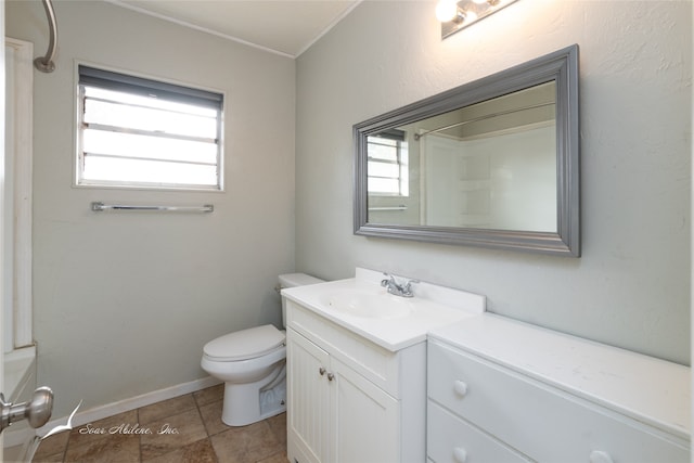 bathroom with vanity, toilet, and plenty of natural light