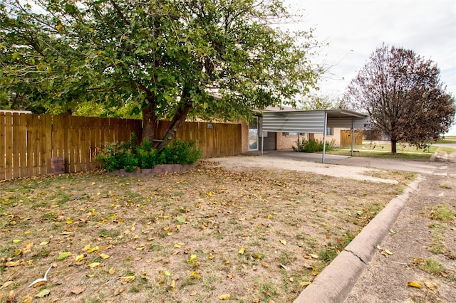 view of yard featuring a carport