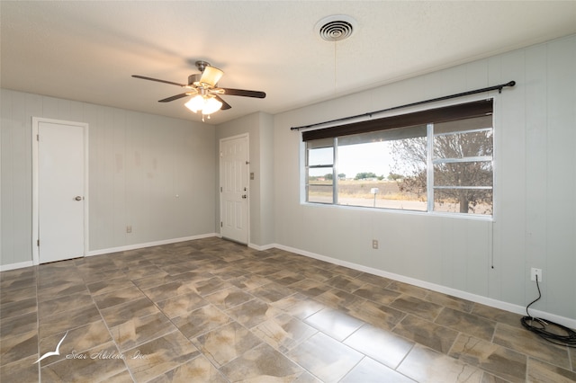 unfurnished room featuring ceiling fan