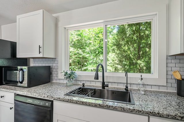 110 Fawn Trl, Mabank, TX 75156 - kitchen featuring black appliances, a sink, backsplash, and white cabinetry