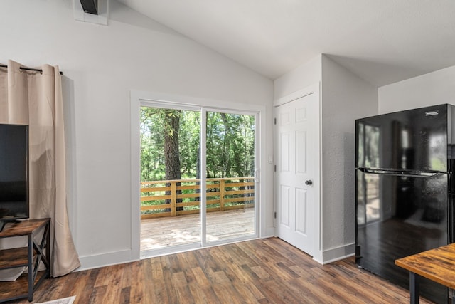 110 Fawn Trl, Mabank, TX 75156 - kitchen featuring freestanding refrigerator, lofted ceiling, and dark wood-type flooring