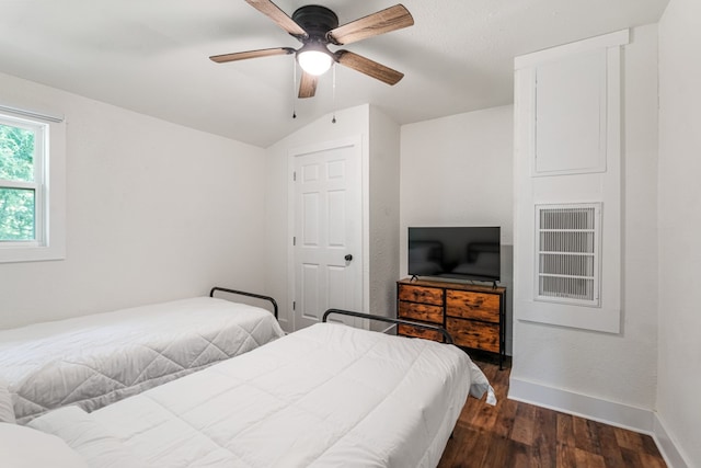 110 Fawn Trl, Mabank, TX 75156 - bedroom featuring dark wood-style floors, baseboards, lofted ceiling, and a ceiling fan
