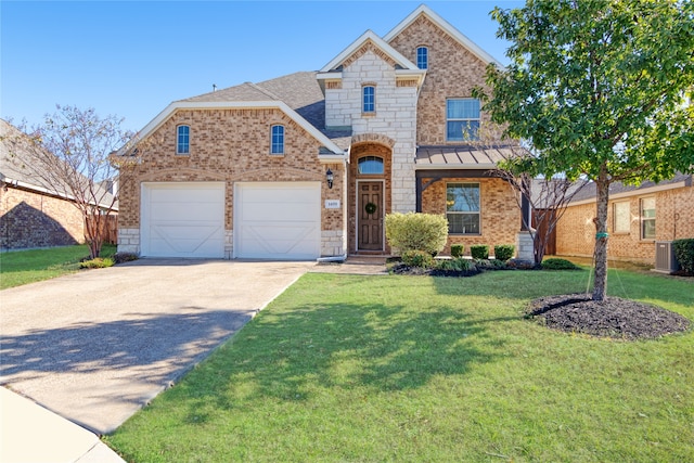 view of front of house featuring central AC unit, a garage, and a front lawn