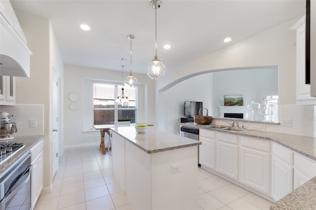 kitchen featuring white cabinets, stainless steel appliances, and sink