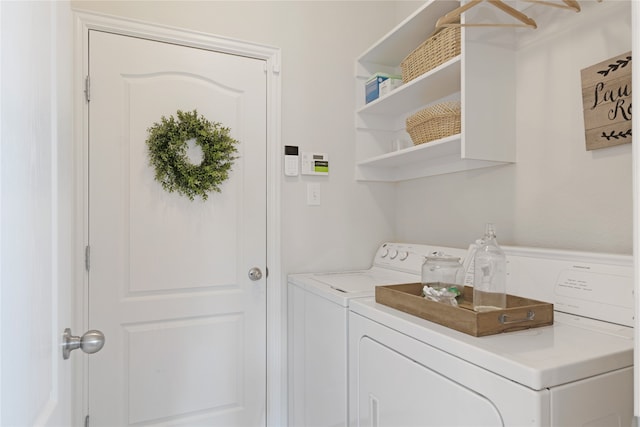 clothes washing area featuring washing machine and dryer