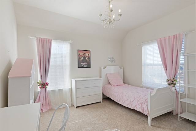 bedroom featuring an inviting chandelier, light colored carpet, and vaulted ceiling