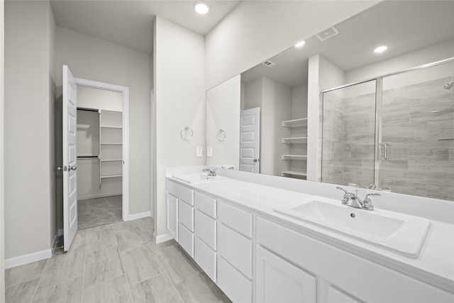 bathroom with vanity and walk in shower