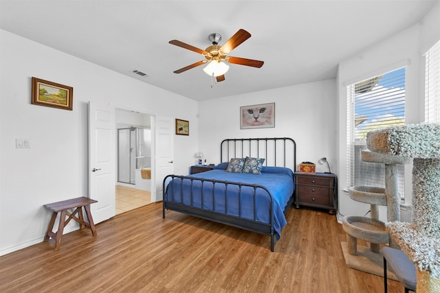 bedroom featuring light hardwood / wood-style floors and ceiling fan