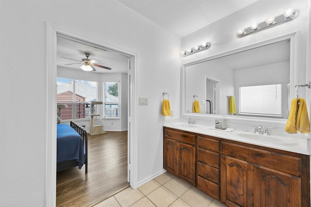 bathroom featuring tile patterned flooring, ceiling fan, and vanity