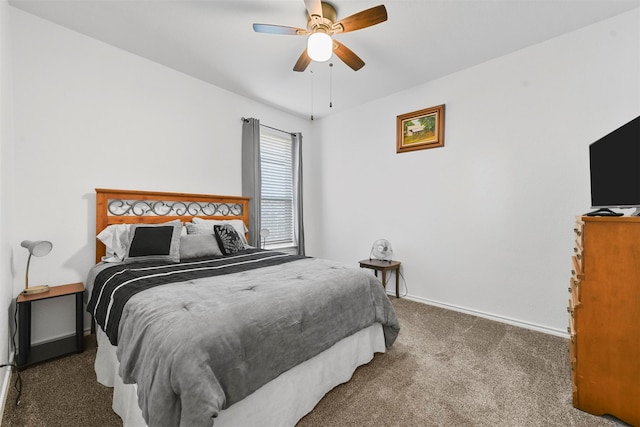 bedroom with dark colored carpet and ceiling fan