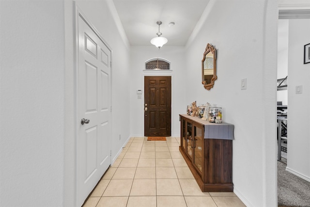 foyer featuring light tile patterned floors