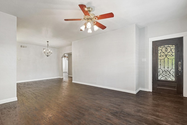 foyer entrance with dark hardwood / wood-style flooring and ceiling fan with notable chandelier