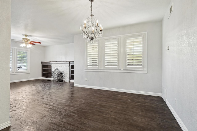 unfurnished living room featuring dark hardwood / wood-style floors and ceiling fan with notable chandelier