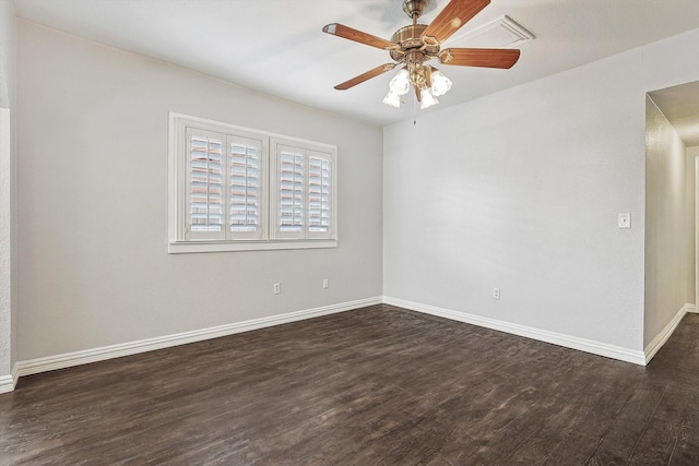 spare room with ceiling fan and dark hardwood / wood-style flooring