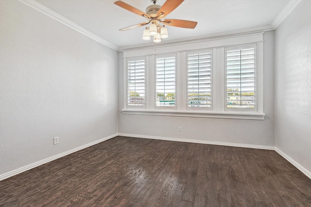 spare room with crown molding, dark hardwood / wood-style floors, and ceiling fan