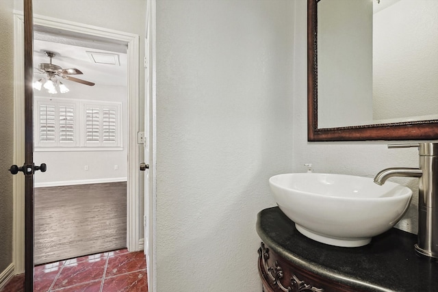 bathroom with vanity, ceiling fan, and hardwood / wood-style flooring