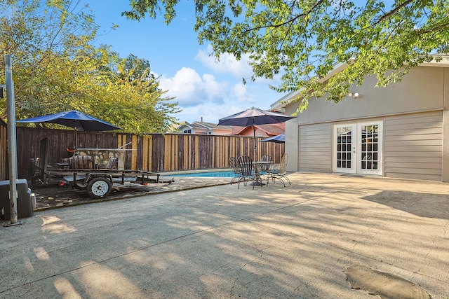 view of patio with a fenced in pool