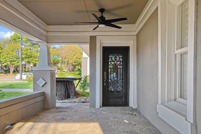 property entrance featuring ceiling fan