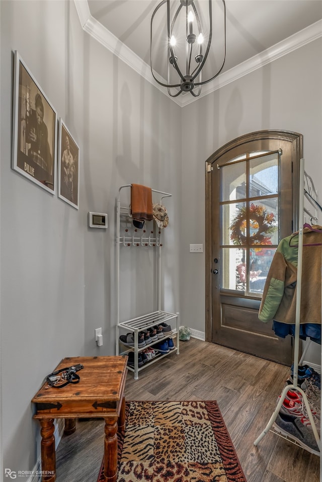 mudroom with a notable chandelier, hardwood / wood-style flooring, and crown molding