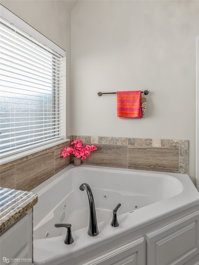 bathroom featuring a tub to relax in