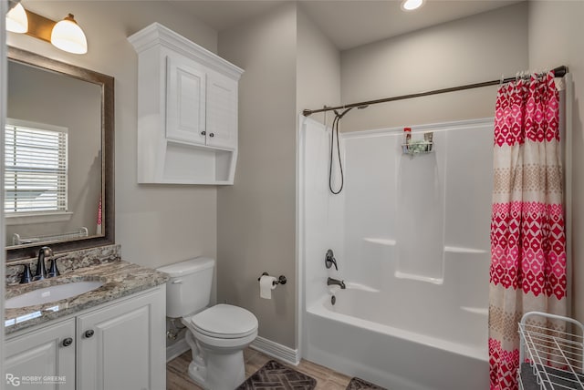 full bathroom featuring vanity, shower / bath combo with shower curtain, wood-type flooring, and toilet