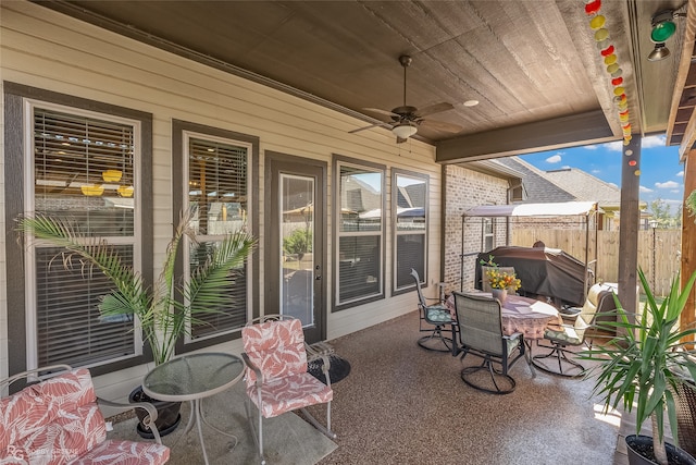 view of patio with grilling area and ceiling fan