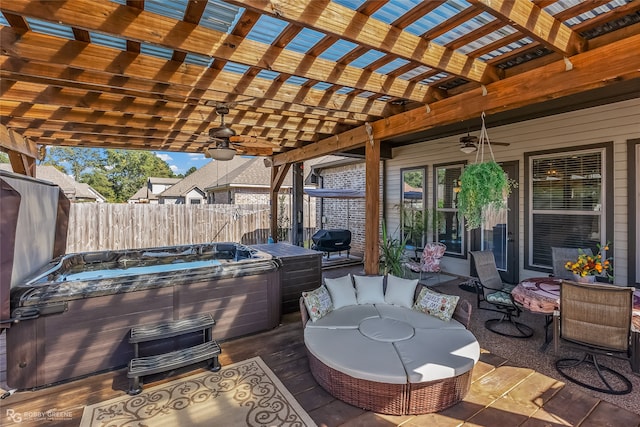 view of patio with a hot tub, a pergola, a wooden deck, ceiling fan, and a grill