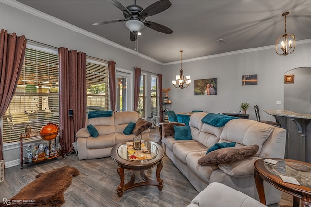 living room featuring crown molding, ceiling fan with notable chandelier, and hardwood / wood-style floors