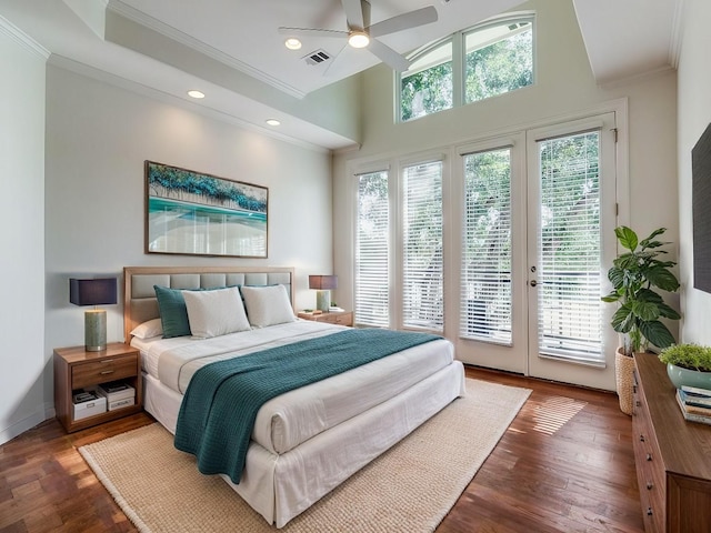 bedroom with crown molding, dark hardwood / wood-style floors, access to exterior, and multiple windows