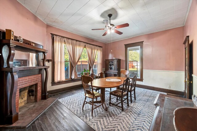 living area with ceiling fan and dark hardwood / wood-style floors