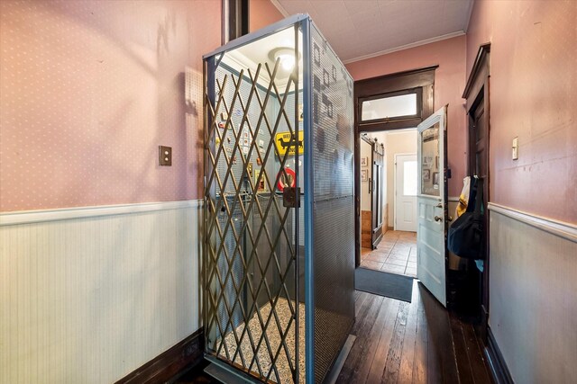 dining area featuring ornamental molding, a healthy amount of sunlight, and hardwood / wood-style floors