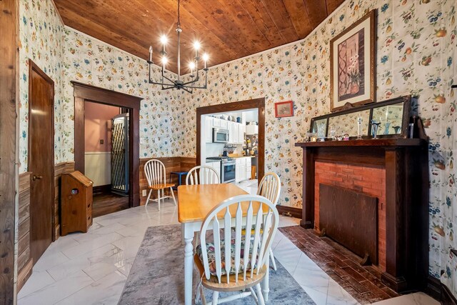 dining area featuring wood ceiling and ceiling fan