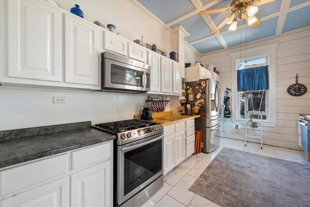 kitchen with white cabinetry, appliances with stainless steel finishes, and coffered ceiling