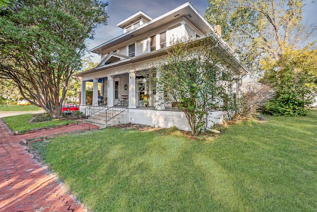 view of front of house with a porch and a front yard