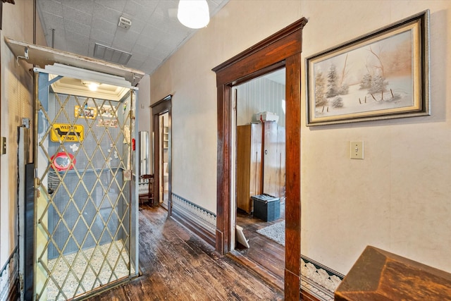 hallway with dark hardwood / wood-style floors